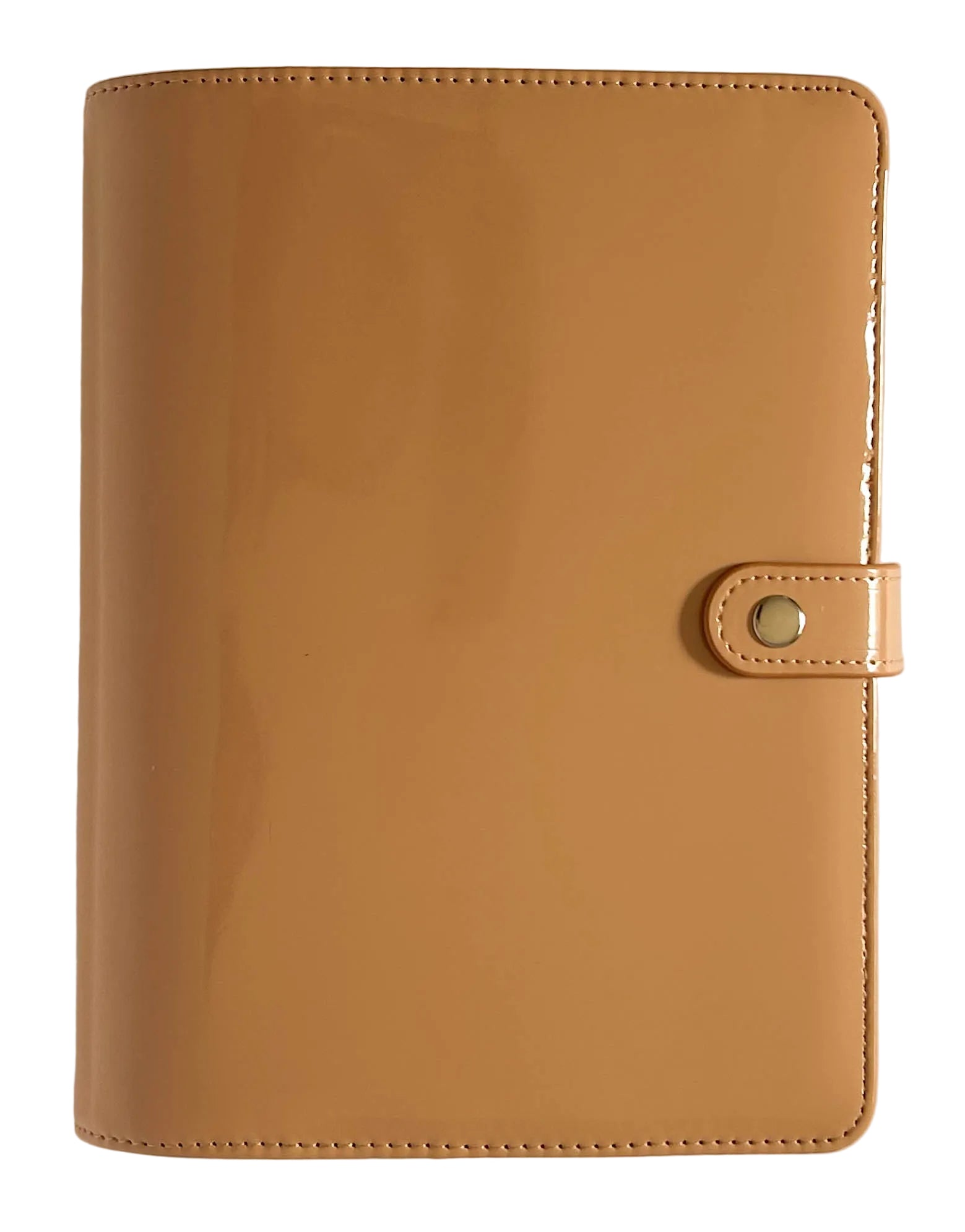 A tan glossy vegan leather planner cover with a snap-button closure strap, shown flat against a light beige background.