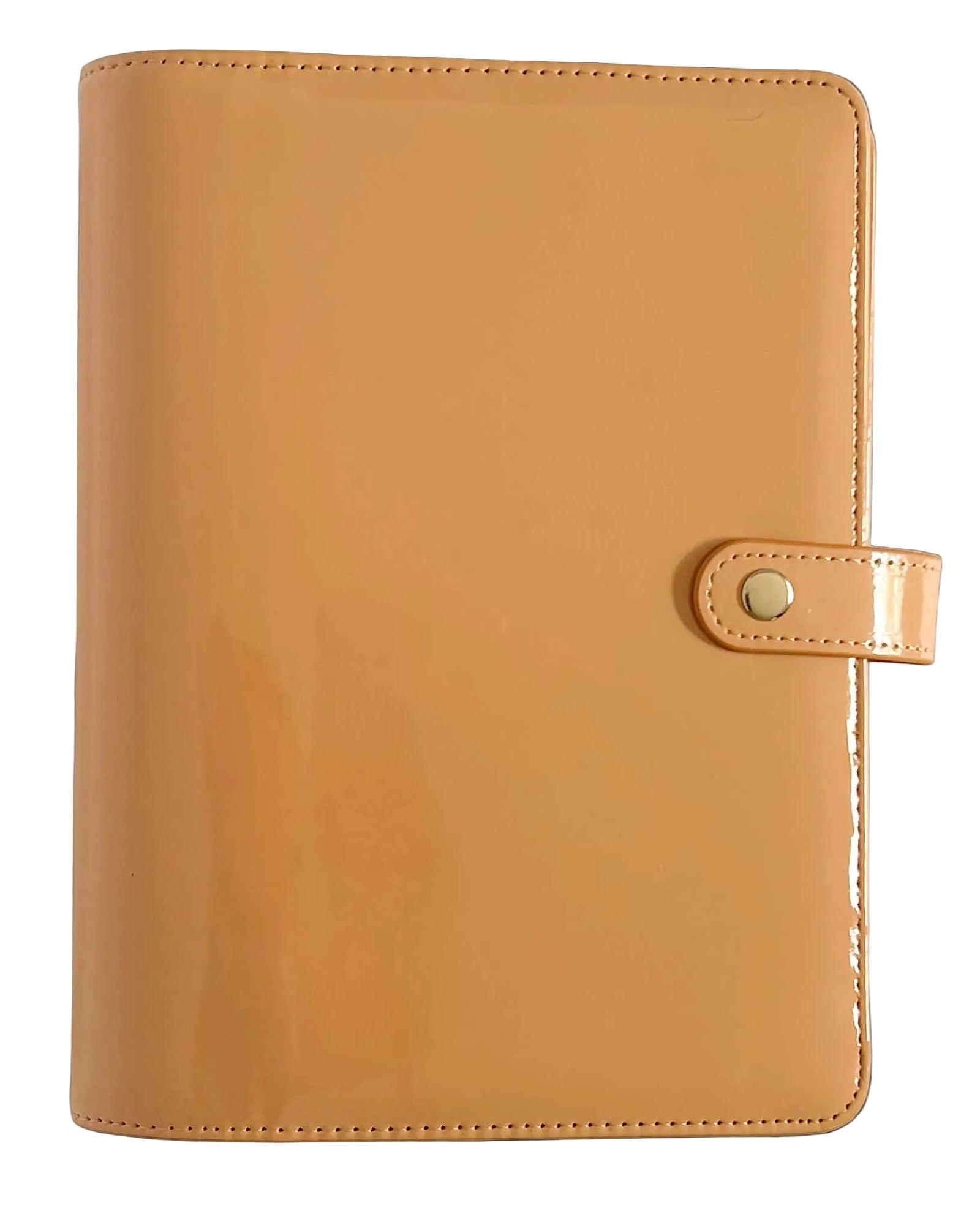 A glossy tan planner cover with a snap-button closure strap, shown flat against a light neutral background.