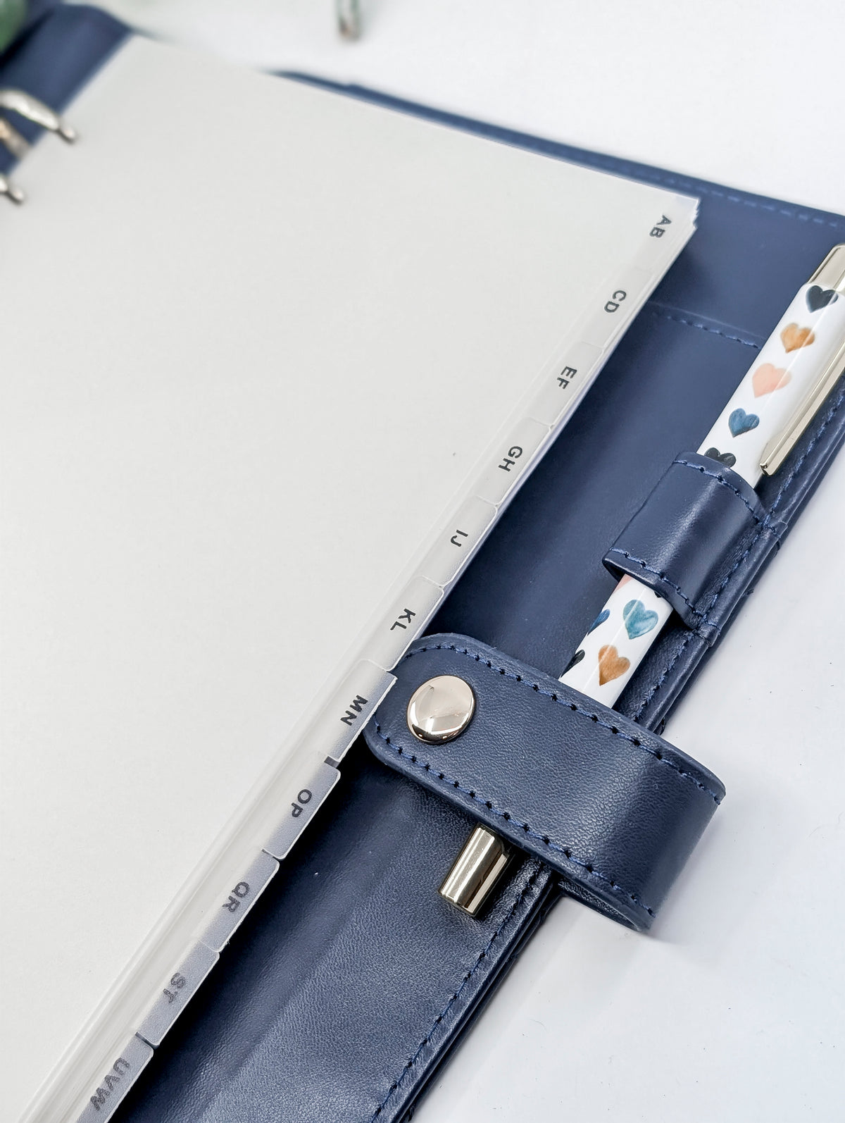 Clear Monthly Dividers in a blue planner